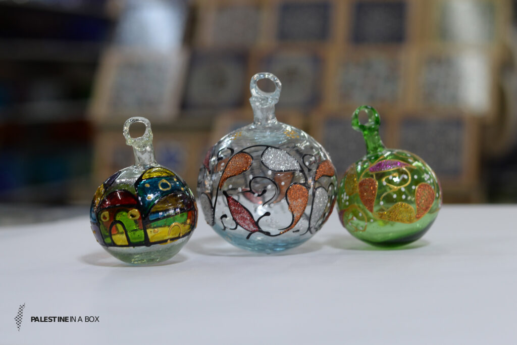The Art of Glass-Blowing 6 Glass blowing is a wide market in Hebron, and they are better known for these ornaments. Today, anyone looking for a handmade piece of Palestine can find even fragile Christmas ornaments ready to be shipped right from the source.